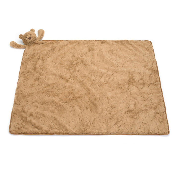 Brown plush blanket with teddy bear toy on a white background