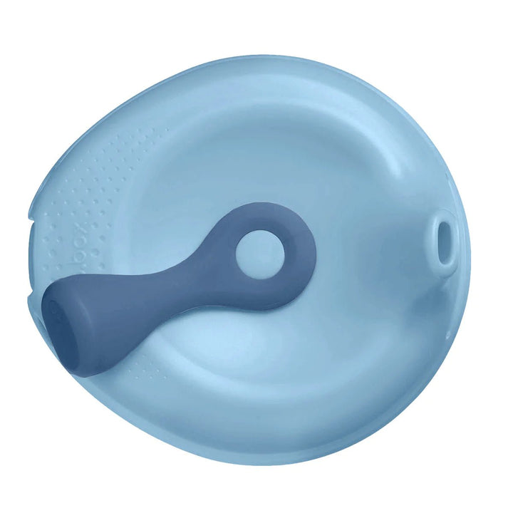 b.box Fill + Feed Storage and Containers Lullaby Blue -  Blue silicone spoon and bowl set on a white background