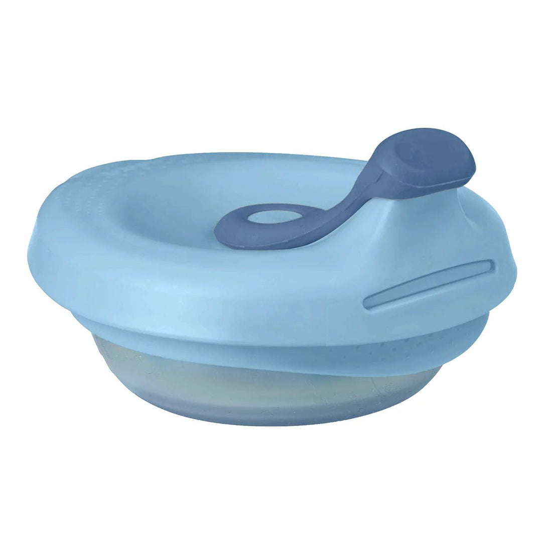 b.box Fill + Feed Storage and Containers Lullaby Blue -  Blue silicone lid with a spoon on a white background