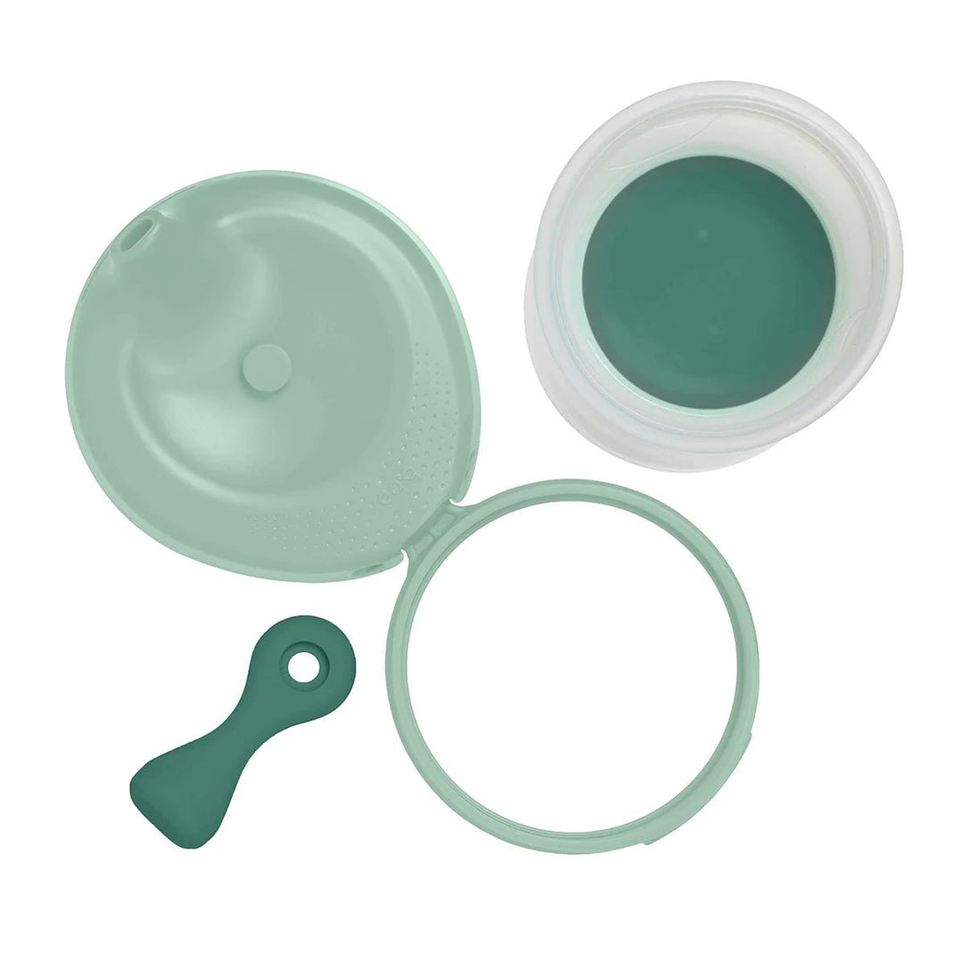 b.box Fill + Feed Storage and Containers Sage -  Green silicone lid, gasket, and spoon on a white background