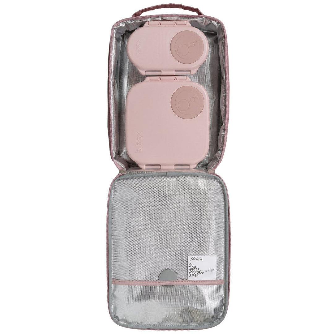 b.box Insulated Flexi Lunchbag Unicorn Dreams - Clear travel bag with pink interior holding a pink travel adapter 