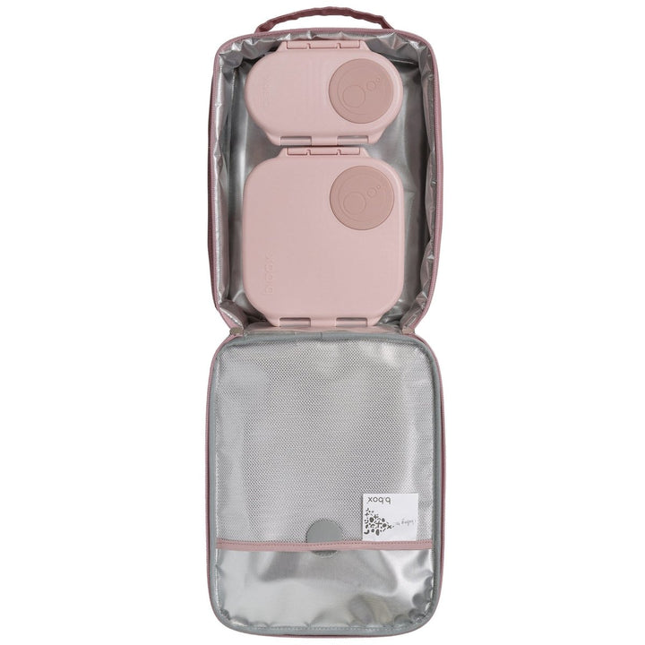 b.box Insulated Flexi Lunchbag Unicorn Dreams - Clear travel bag with pink interior holding a pink travel adapter 