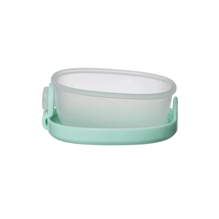 b.box Snack Tubs Forest - Mint green and white silicone food container on a white background