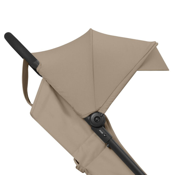 Cybex Agis Baby Strollers Almond Beige/Black Frame - Beige baby stroller canopy with black handle on a white background