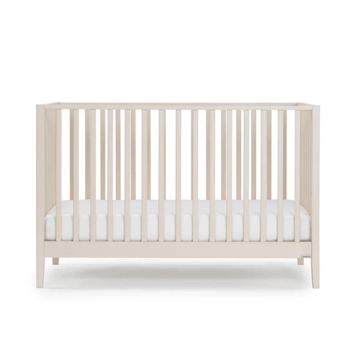 Dadada Furniture Lala 3 in 1 Convertible Crib Cribs & Toddler Beds Almond Milk - I Beige crib with white mattress on a white background