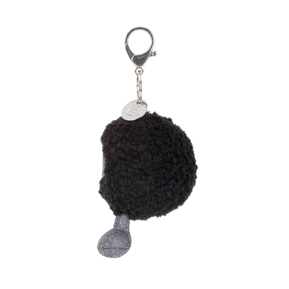 Amuseables Black Hole Bag Charm - Black pom-pom keychain with a silver tag on a white background