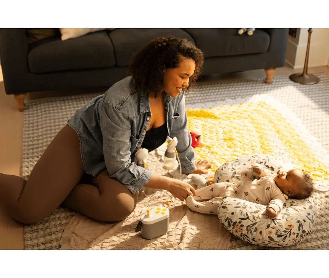 Mother using Medela Pump In Style Pro+ electric breast pump
