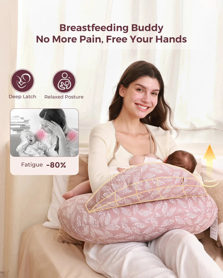 Parent using the Momcozy Adjustable Nursing Pillow with Pink Leaves pattern for ergonomic feeding support.