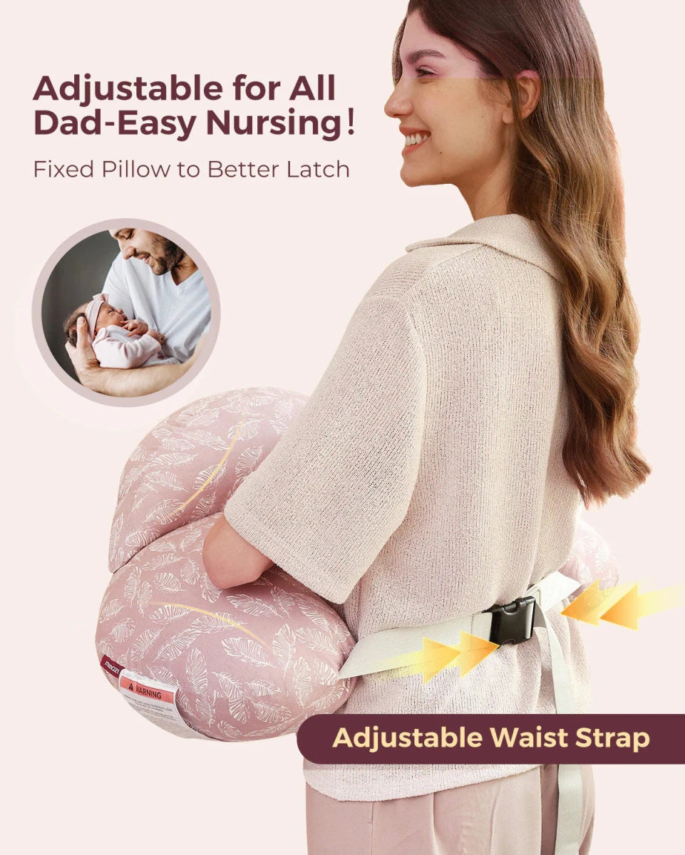 Mother smiling while using the Momcozy Adjustable Nursing Pillow with adjustable waist strap during feeding.