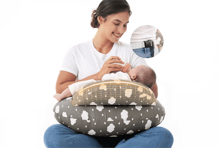 Parent holding a baby with the Momcozy Adjustable Nursing Pillow in Grey Clouds for comfortable feeding support.