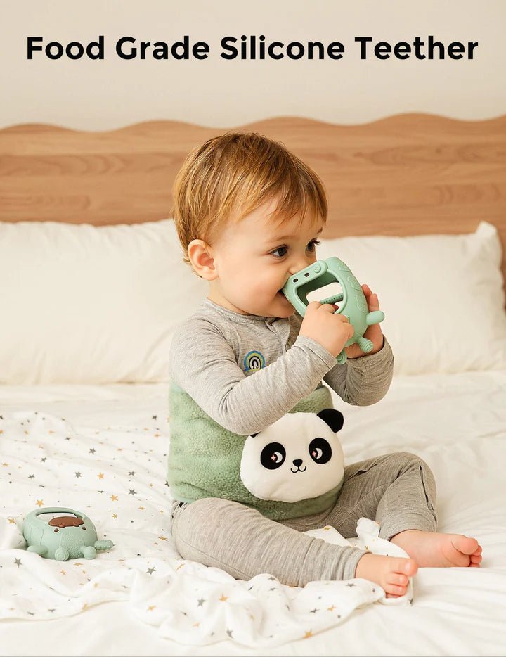 Momcozy All-in-1 Glow Baby Kit Baby Care - Kits - Baby playing with a panda silicone teether on a bed