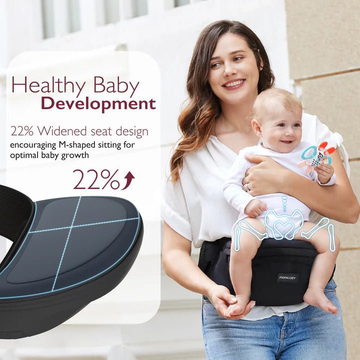 Momcozy Wander360 Hip Seat Carrier with widened ergonomic seat supporting healthy hip development and parent comfort