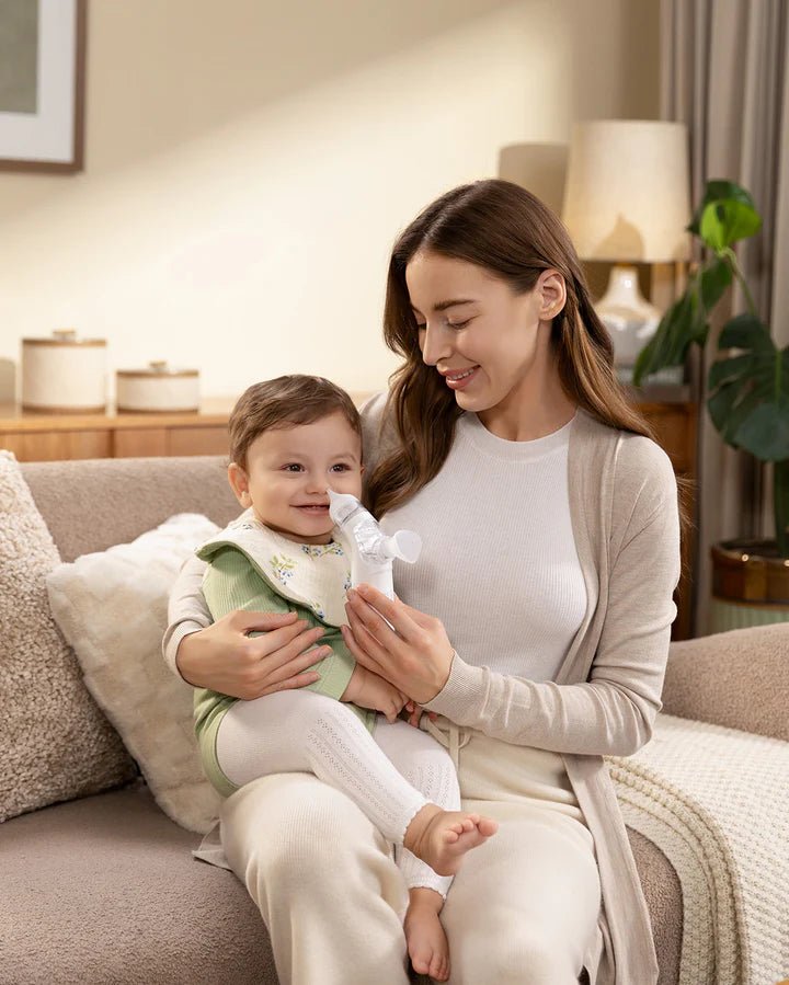 Momcozy BreezyClear 2-in-1 Electric Nasal Aspirator helping keep baby's nose clear at home