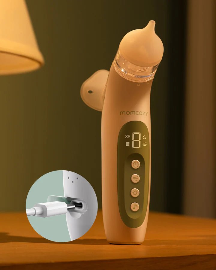 Close-up of Momcozy BreezyClear electric nasal aspirator with spray attachment and digital display