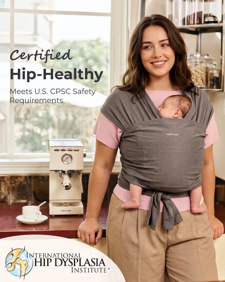 Parent using the Momcozy Easy to Wear Hands-Free Baby Wrap Carrier with certified ergonomic baby positioning.