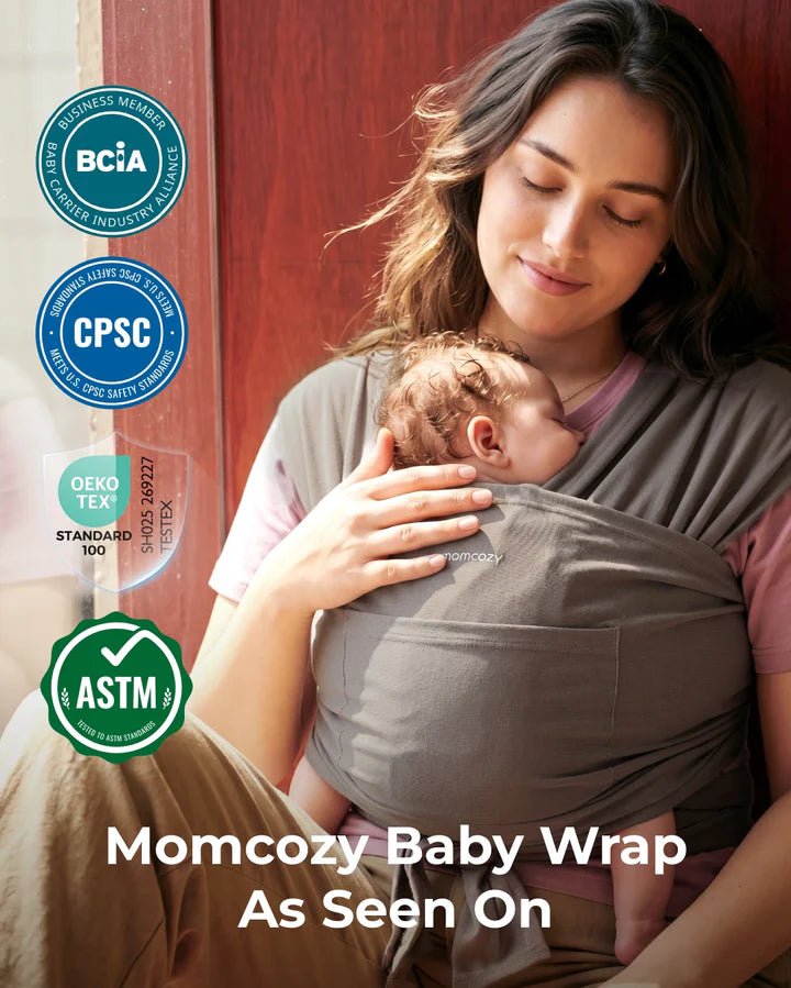 Parent wearing the Momcozy Easy to Wear Hands-Free Baby Wrap Carrier in Deep Grey while safely carrying a baby.