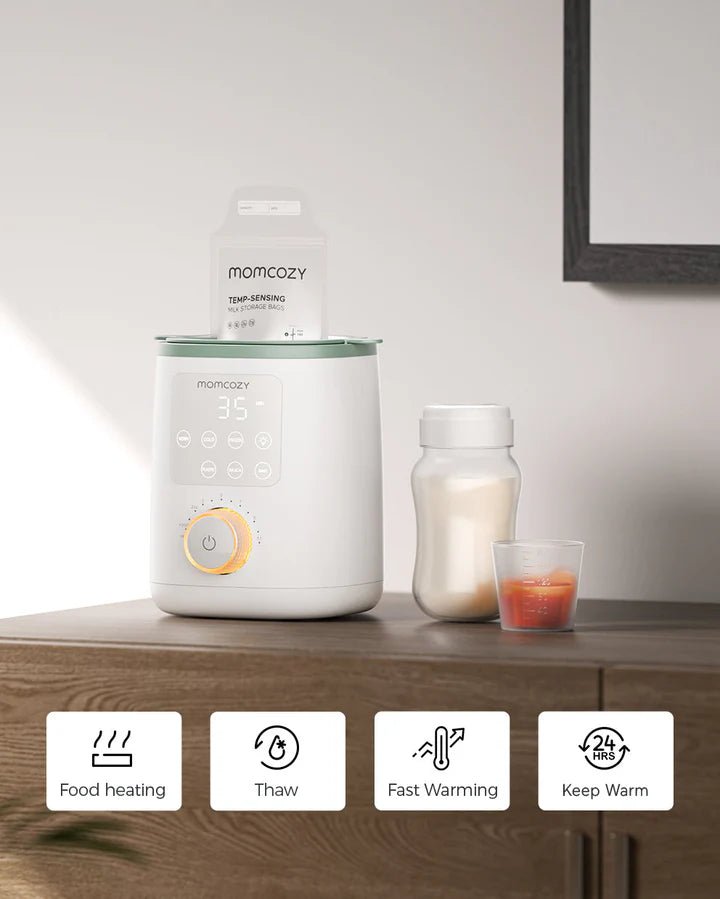 Momcozy Nutri Smart Analog Baby Bottle Warmer displayed on countertop with baby bottle for everyday feeding routine