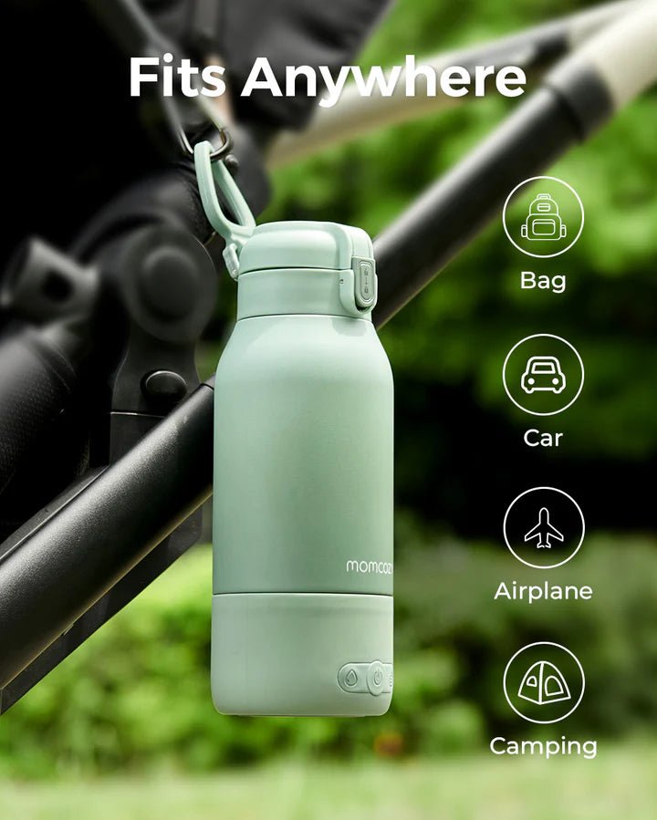 Momcozy portable breast milk and water warmer attached to a stroller, ideal for travel, camping, flights, and daily outings.