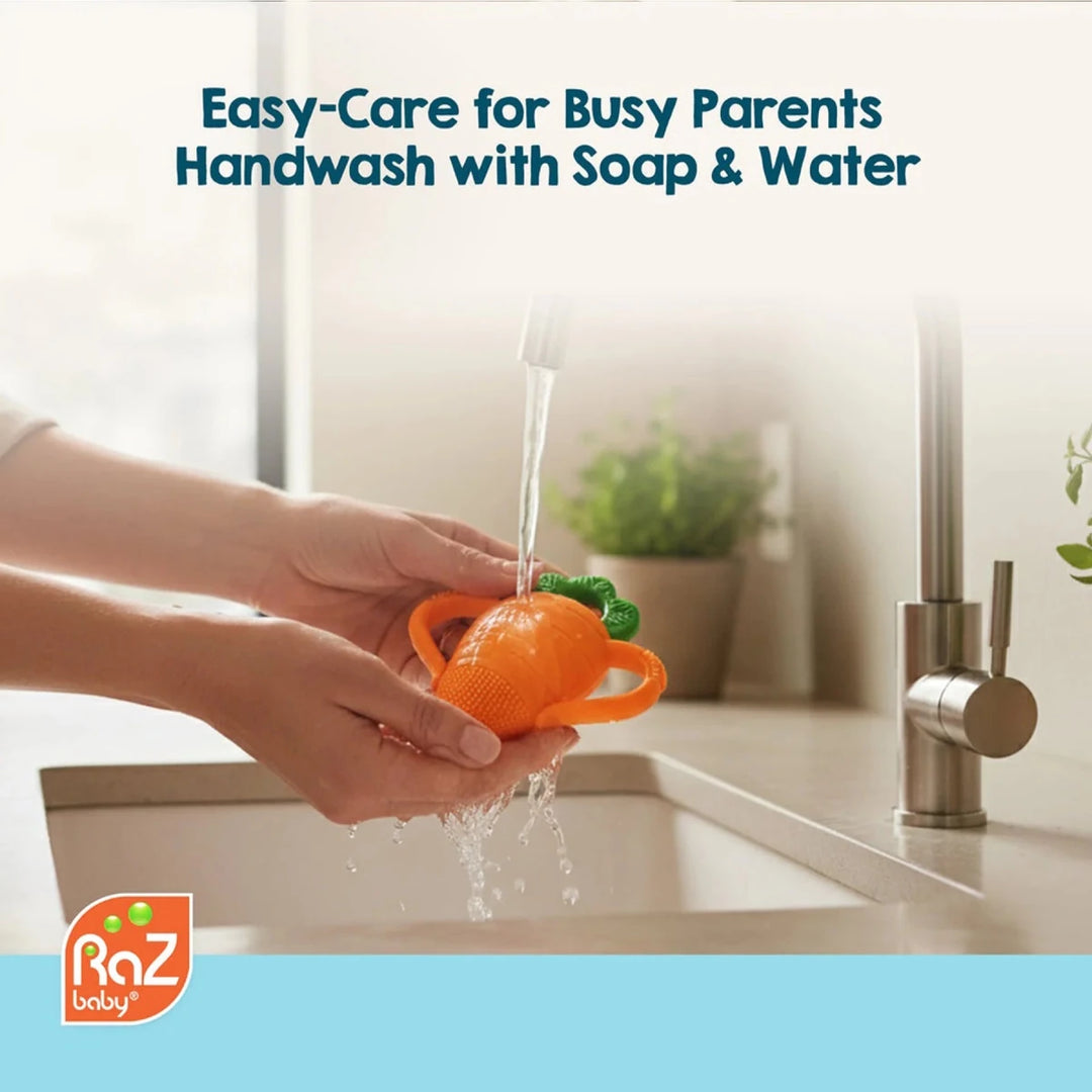 Razbaby Carrot Teether in a playful setting with the carrot body and green top detail, showcasing baby-friendly design.