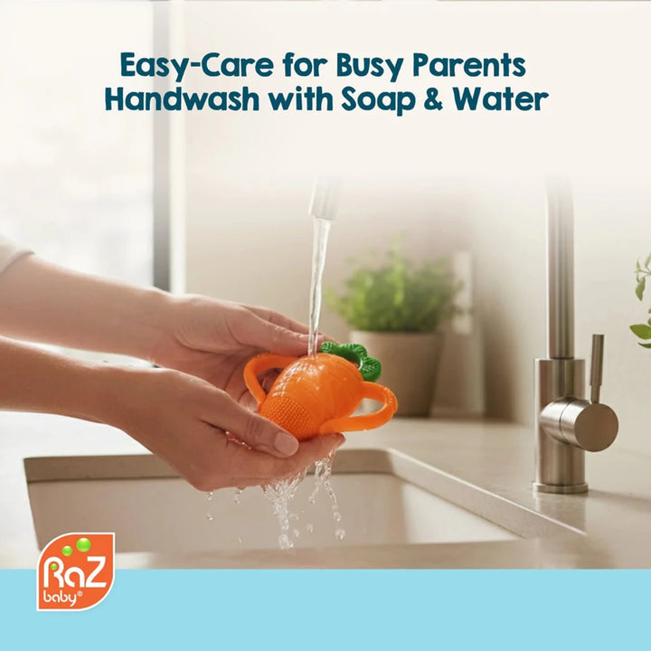 Razbaby Carrot Teether in a playful setting with the carrot body and green top detail, showcasing baby-friendly design.