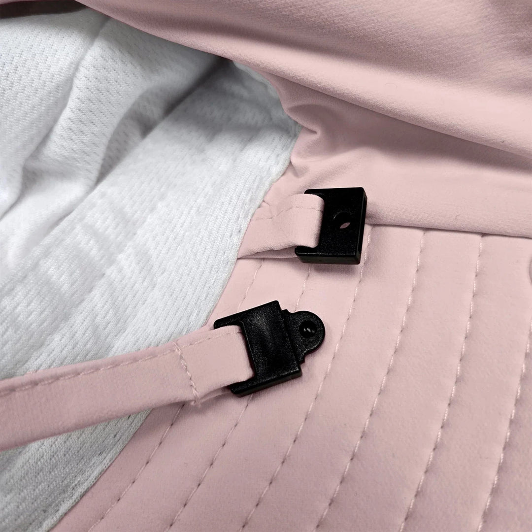 Stonz Explorer Hat 2026 Blush - Close-up of a pink quilted bag with black straps and buckles.