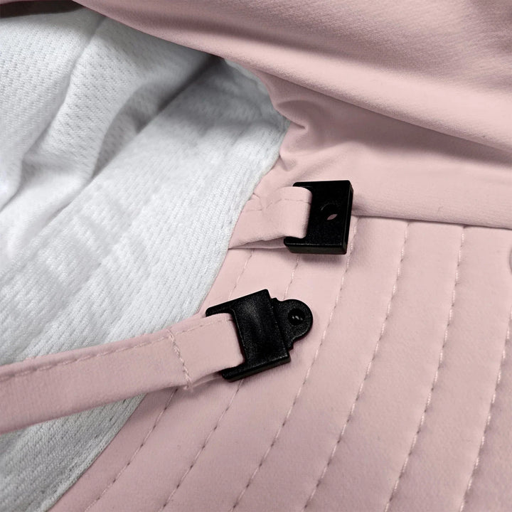 Stonz Explorer Hat 2026 Blush - Close-up of a pink quilted bag with black straps and buckles.