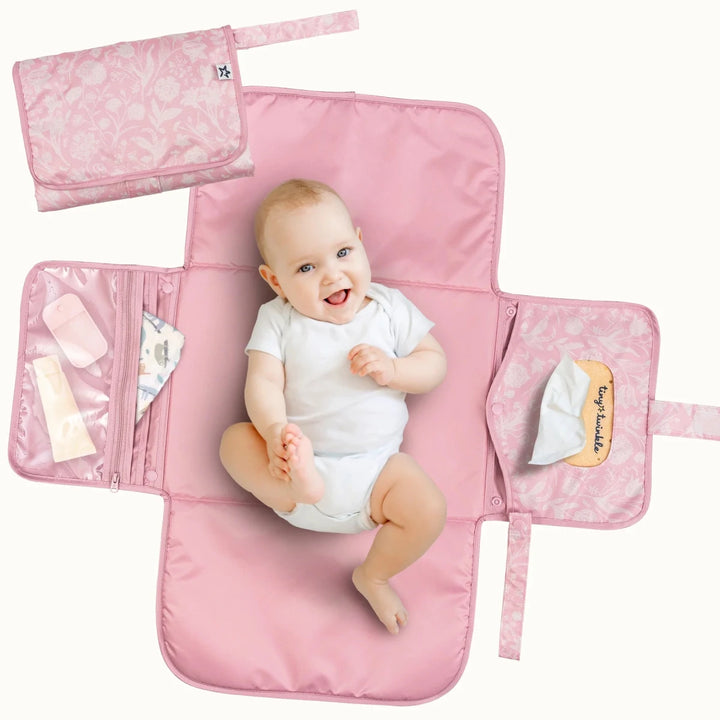 Pink Tiny Twinkle portable diaper changing pad featuring a toile floral pattern