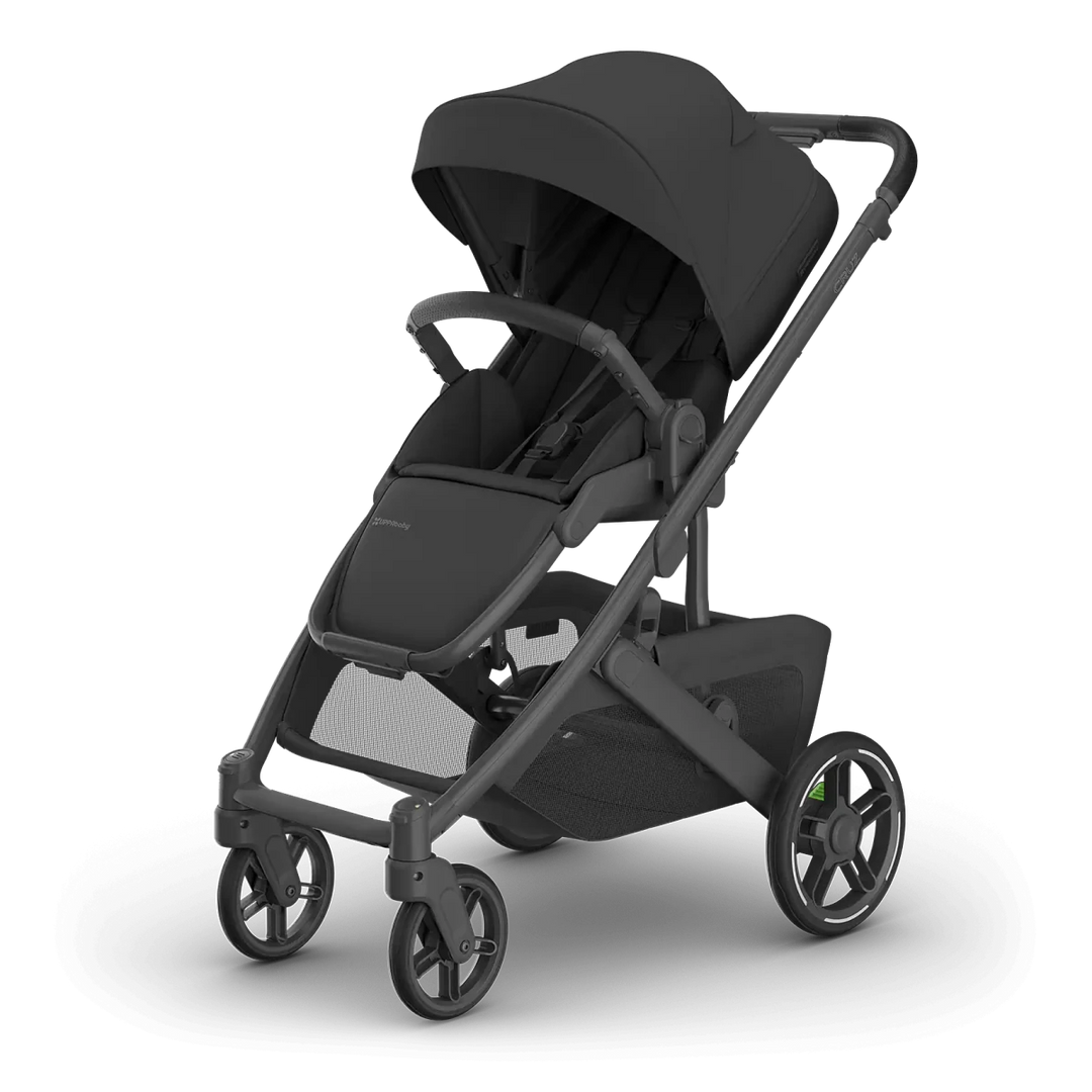 A premium UPPAbaby Cruz V3 Stroller  in dark gray and black, shown from a three-quarters angle on a clean white background. 