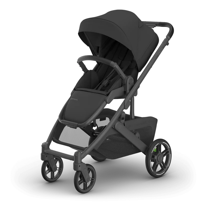 A premium UPPAbaby Cruz V3 Stroller  in dark gray and black, shown from a three-quarters angle on a clean white background. 